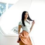 Pic of Hot brunette reveals her nice ass while getting naked in deck shoes