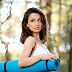 Pic of Petite teen with an ass to die for does yoga in the woods while bare naked