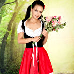 Pic of Cute teen Lada tugs on pigtails before spreading her twat lips after disrobing