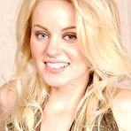 Pic of Natural blonde Gina slips off denim jeans before modeling topless in panties