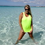 Pic of Middle-aged blonde Sweet Susi exposes herself in pristine ocean waters