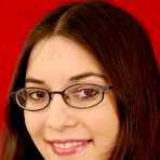 Pic of Nerdy amateur Larisa licks a knee after getting naked with her glasses on