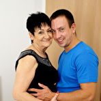 Pic of Older woman is relieved of her dress and pretties during foreplay with a boy
