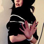 Pic of Brunette female finds herself being continually put into bondage