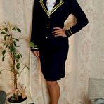 Pic of Flight attendant hitches up her skirt while struggling against handcuffs
