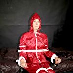 Pic of Amateur model Pia is tied to a hairdresser chair in a raincoat while gagged