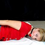 Pic of Blonde chick Albina Rose is hog tied and gagged in a T-shirt and jeans
