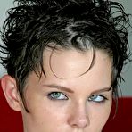 Pic of First timer with short hair strips naked on a red sofa for first nude poses