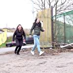 Pic of Teen girls Nicolette Noir and Mistika squat to piss behind a building