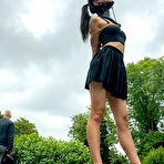 Pic of Asian chick Flawless Meow wears a neck collar with her arms bound in a park