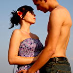 Pic of Horny young couple has sex on a mound of loose straw in a field