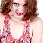 Pic of Teen first timer Tara Estell baring tiny tits and pierced cunt while disrobing