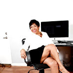 Pic of Fatty latina mature office lady revealing her jugs and twat