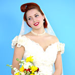 Pic of Natural redhead Lucy V slips off her wedding dress to bare big natural tits