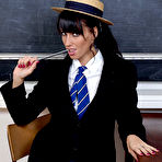 Pic of Boarding school student Tammy Lee doffs her uniform while in a classroom