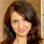Pic of Barely legal cutie Dena takes off all her clothes while alone on a sofa