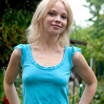 Pic of Petite blonde sweetheart Feeona poses in the nude by the pool