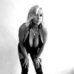 Pic of Stocking and lingerie attired housewife displaying huge boobs for babe pics