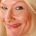 Pic of Granny blonde Roxy is demonstrating her naked pussy and boobies