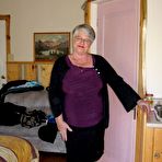 Pic of Fat granny Girdle Goddess exposes her pussy in crotchless panties and a girdle