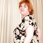 Pic of Redhead granny with massive flabby tits exposing her hairy cunt