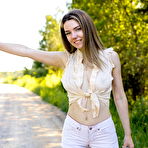 Pic of Pretty teen Kiere exposes her great body while hitchhiking on a dirt road