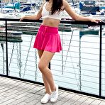 Pic of Young brunette Liz Jordan models a bikini at a marina before sex at home
