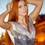 Pic of Natural redhead Carinela displays her flexible body during a totally nude gig