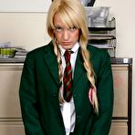 Pic of Blonde student exposes her bum for a caning from her female teacher
