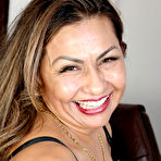 Pic of 30 plus Latina lady Roxy Rocks masturbates after disrobing to her stockings