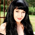 Pic of Raven-haired fetish fixen in sexy outfit toying her vag and rare hole outdoor