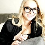 Pic of Blonde girl in glasses poses in sexy white underwear and long socks