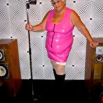 Pic of Overweight UK nan Grandma Libby steps up to the microphone before getting nude