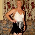 Pic of Blonde grandmothers engage in lesbian foreplay on a chesterfield