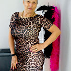 Pic of Old woman Savana doffs an animal print dress to pose nude in stockings & boots