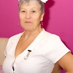 Pic of Mature nurse Savana takes off her uniform and lingerie in white stockings