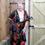 Pic of Old woman Valgasmic Exposed exposes saggy tits and big ass in yard