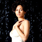Pic of Mixed race female Pammie Lee demonstrating nice melons and trimmed bush
