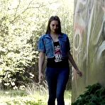 Pic of White girl Viktoria pulls down her jeans to take a pee near a wall of graffiti