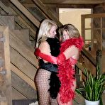 Pic of Mature amateur Devlynn and a woman wear long gloves during lesbian sex