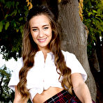 Pic of Pornstar Cassidy Klein slipping off schoolgirl clothes to model naked on table