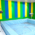 Pic of Clothed lesbians pleasure each other while getting messy in slime filled pool