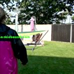 Pic of Shinynylonartsbound | Sandra being tied, gagged and showered in a hammock with ropes and a gag by Sophie both wearing shiny nylon rainwear (Video)