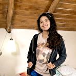 Pic of Lovely Maria F strips and plays with her long pussy hair on the bed - NakedPics