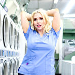 Pic of Christie Stevens  & Eva Nyx Posing in the Laundromat